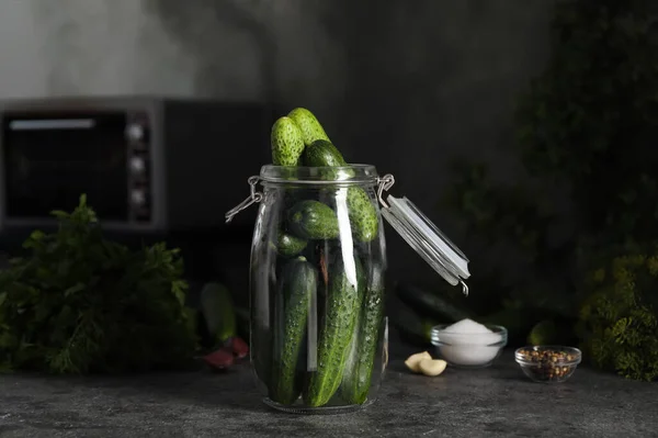 Pickling jar with fresh cucumbers on dark grey kitchen table — Stock Image Pickling Jar Fresh Cucumbers Dark Grey Kitchen Table Stock Picture