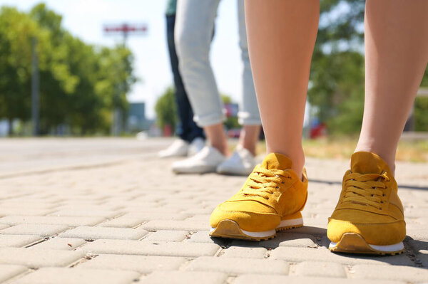 People keeping social distance in line outdoors, closeup. Coronavirus pandemic