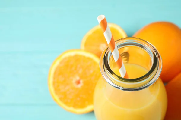 Bottle Orange Juice Fresh Fruits Light Blue Wooden Table Closeup — Stock Photo, Image