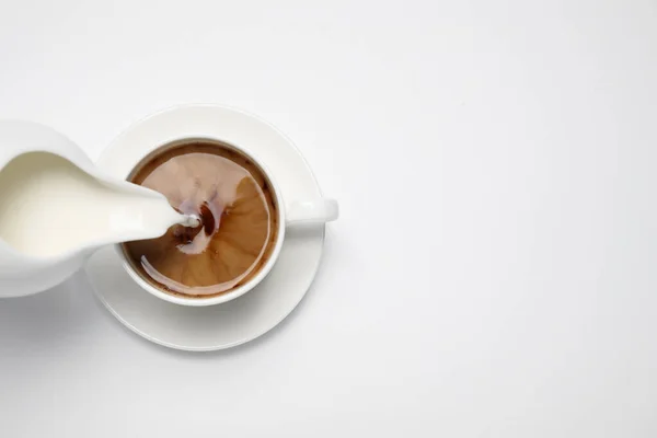 Pouring Milk Cup Coffee White Background Top View — Stock Photo, Image