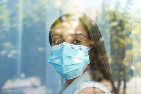 Stressed Woman Protective Mask Looking Out Window View Glass Self — Stock Photo, Image