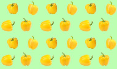 Açık yeşil arka planda sarı dolma biber deseni