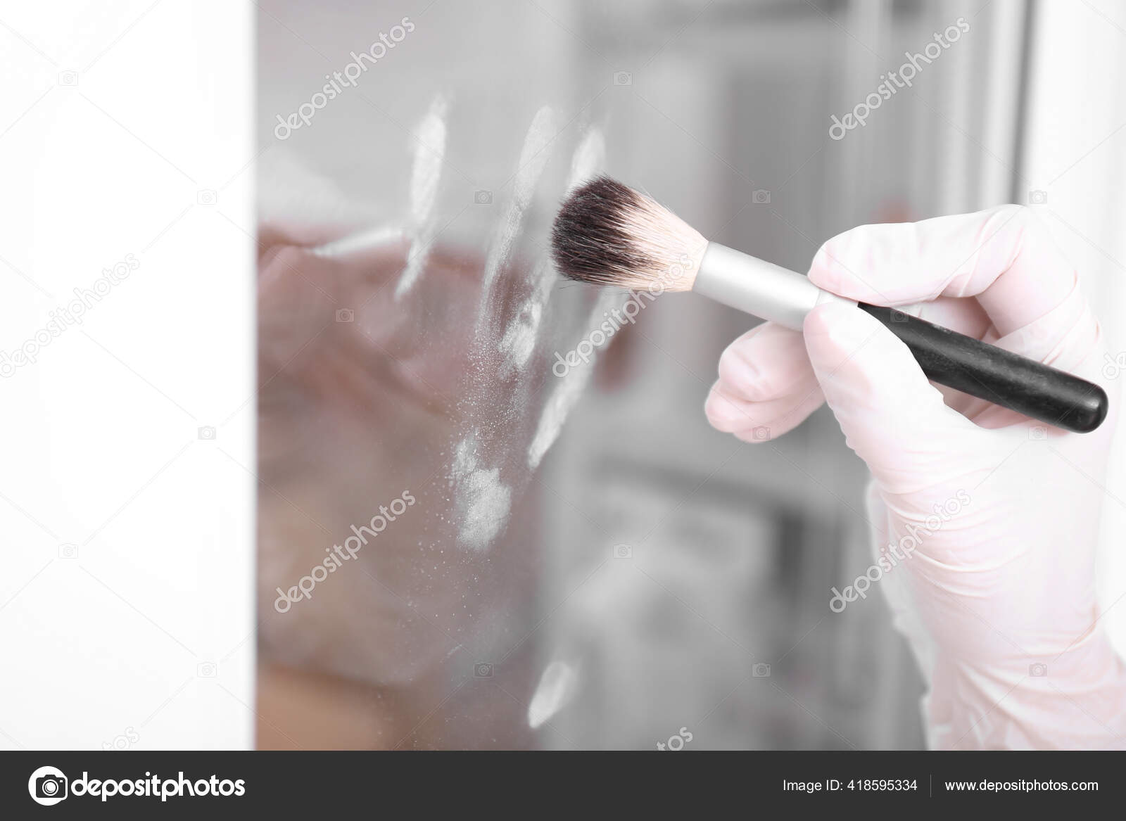 https://st4.depositphotos.com/16122460/41859/i/1600/depositphotos_418595334-stock-photo-detective-using-brush-powder-reveal.jpg