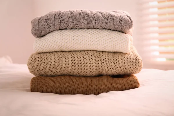 Stack Folded Warm Sweaters Bed Indoors — Stock Photo, Image