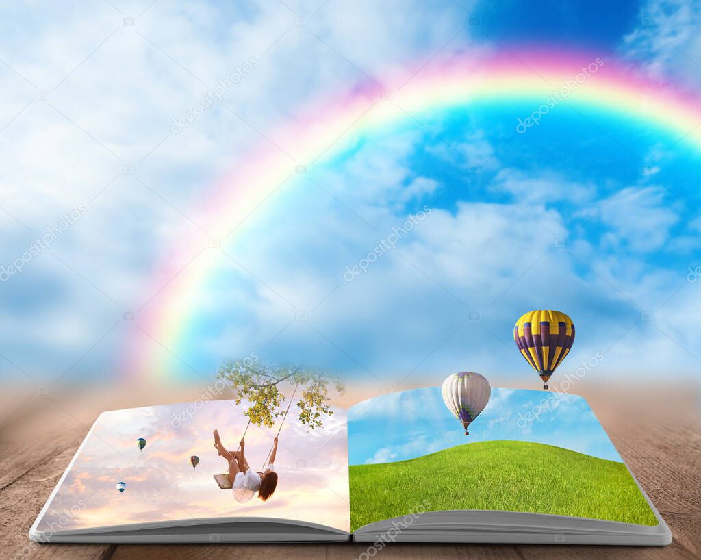 Fantasy worlds in fairytales. Book, hot air balloons and rainbow in cloudy blue sky on background