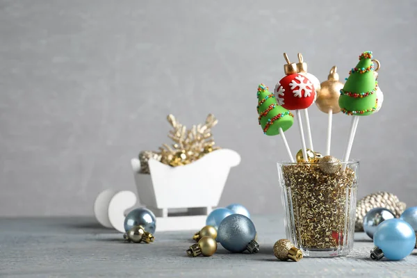 Delicious Christmas Themed Cake Pops Festive Decor Wooden Table Grey — Stock Photo, Image