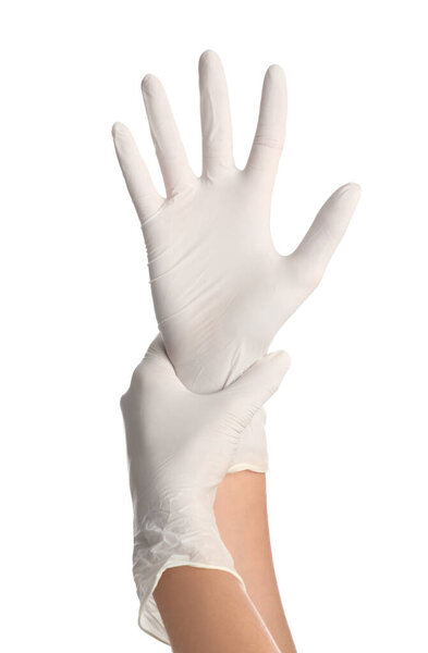 Doctor wearing medical gloves on white background, closeup