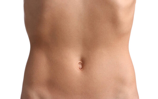 Женщина с плоским животом на белом фоне, крупным планом