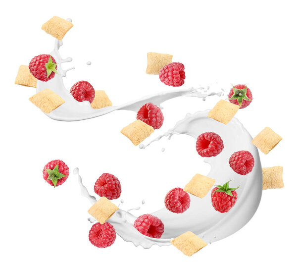 Splashing milk with sweet corn pads and fresh raspberries in air against white background. Healthy breakfast