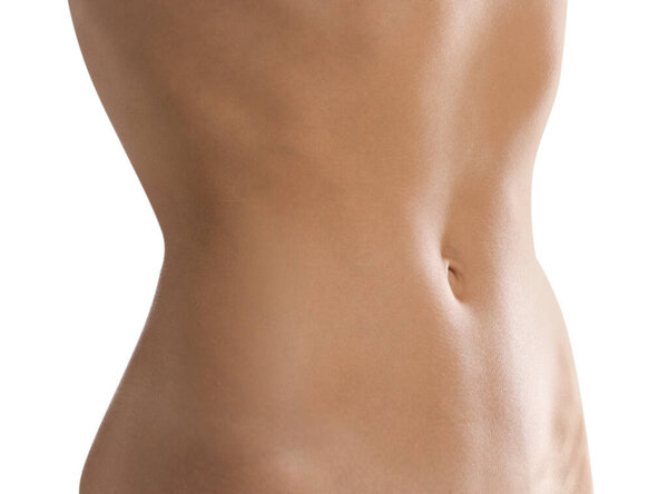 Женщина с плоским животом на белом фоне, крупным планом