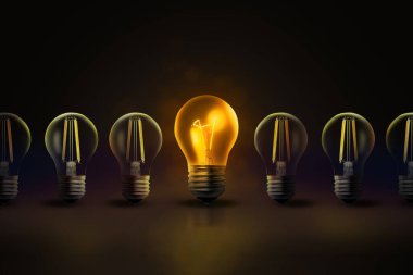 Fikir kavramı. Karanlıkta parlayan bir ampul