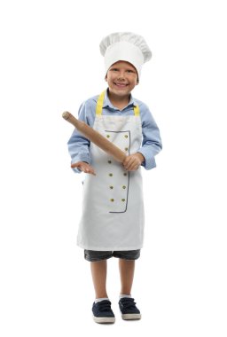 Meslek seçimi. Beyaz arka planda aşçı gibi davranan, oklavalı küçük çocuk.