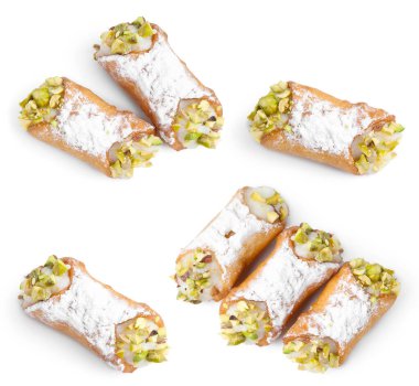 Delicious cannoli with ricotta cheese, pistachios and powdered sugar isolated on white, set. Top view