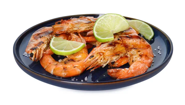 Tasty grilled shrimps with lime and salt isolated on white. Delicious seafood dish