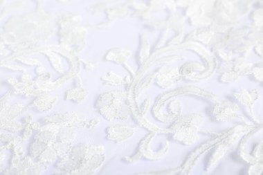 Beautiful lace fabric on white background, closeup