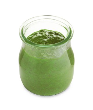 Fresh pesto sauce in jar isolated on white