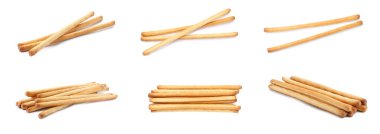 Delicious grissini sticks isolated on white, set