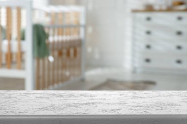 Baby room with empty white table. Space for design