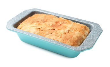 Freshly baked cornbread in baking dish isolated on white