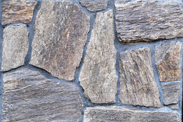 Color stone wall, background, texture, rectangular natural stones of different shades