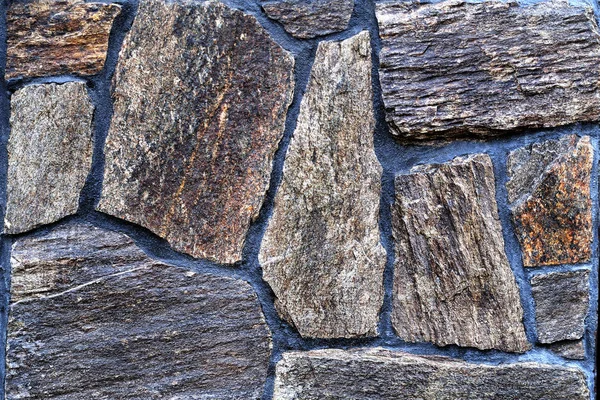 Color stone wall, background, texture, rectangular natural stones of different shades