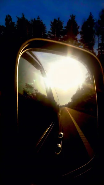 car mirror reflection of the morning sun in the mirror the terra