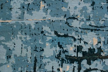 Eski bir arka plan ile bir eski püskü ahşap doku şeklinde farklı renkteki boya yıpranmış. Vintage kaplama farklı boyutlarda kurullarında. Kırık keskin ahşap.