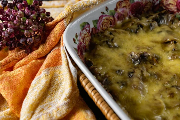 Baked julienne with meat, mushrooms and mushrooms under a cheese cap. Molten fermented milk product hard cheese, hot dish from the oven — Stock Image Baked Julienne Meat Mushrooms Mushrooms Cheese Cap Molten Fermented Milk Royalty Free Stock Photos