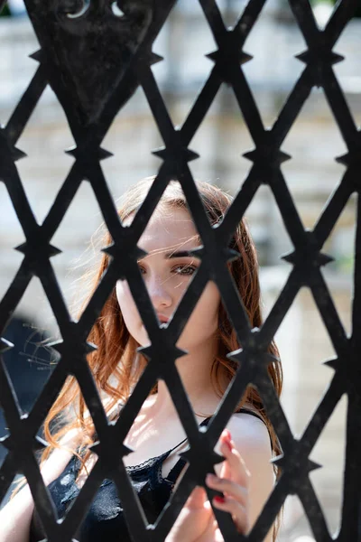 Charming Red Haired Girl Looks Camera Forged Steel Grate — Stock Photo, Image