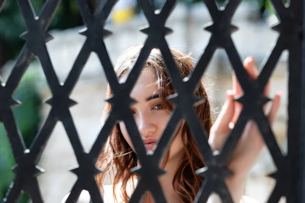 Charming Red Haired Girl Looks Camera Forged Steel Grate — Stock Photo, Image