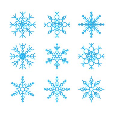 Beyaz arka plan üzerinde izole mavi kar taneleri kümesi