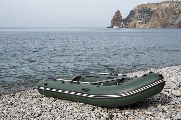Inflatable rubber boat on the beach.