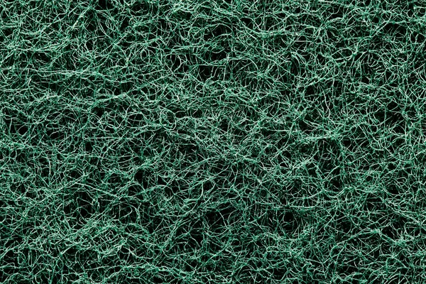 The texture surface of the abrasive synthetic fiber.