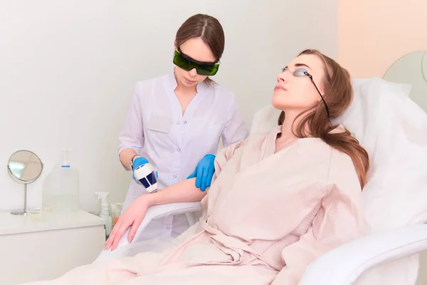 Laser procedure in the clinic of laser cosmetology.