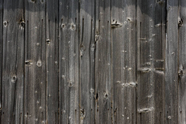Old wooden wall texture. Nailed boards.