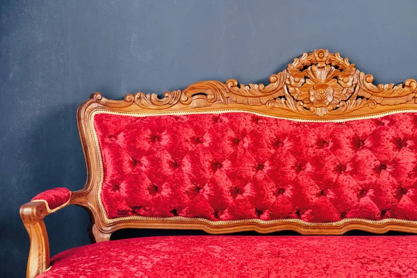 Detail of Luxurious antique red sofa