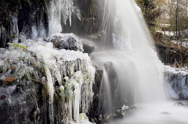 Water mill near a stream in winter.Long exposured frozen water.Caykara,Trabzon Turkey