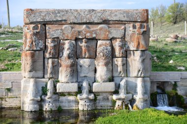 The Hittite spring sanctuary of Eflatun Pinar lies about 100 kilometres west of Konya close to the lake of Beysehir in a hilly, quite arid landscape clipart