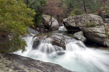 The Hasanboguldu river and waterfalls in Edremit district of Balikesir province of Turkey. clipart