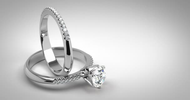 結婚式の白い背景の上のダイヤモンドの指輪のソリティア — ストック動画
