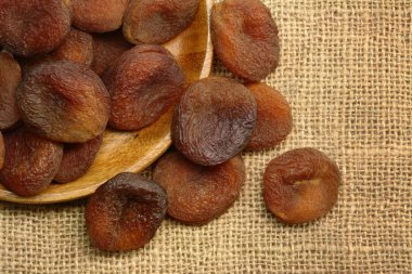 A Plate of Sundried Apricots on Sackcloth clipart