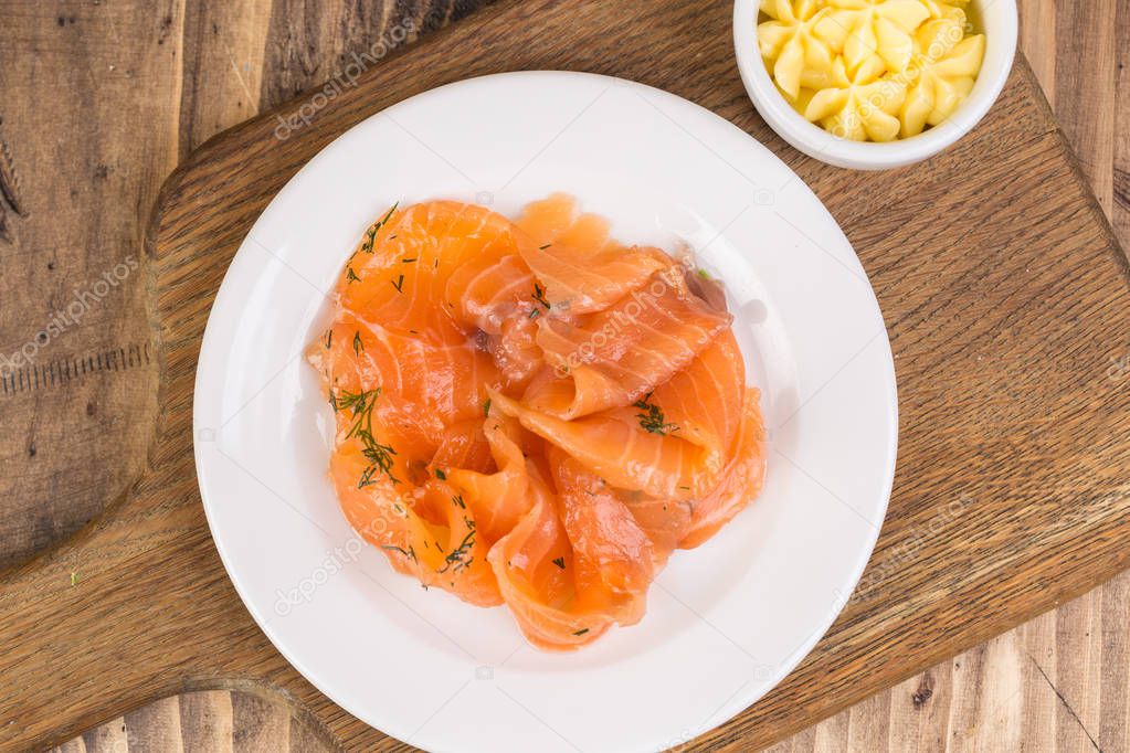 plate with salmon and butter
