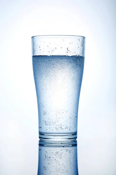Glass cup with water on a white background