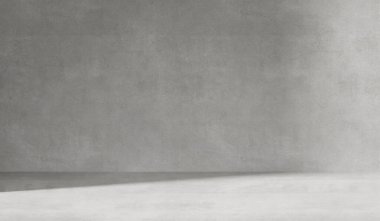 Çimento duvar desenli gri arkaplan. Pencereden yumuşak gölgeler görünen ürün sunumları için minimalist soyut arkaplan