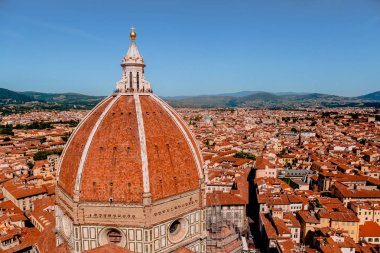 FLORENCE, ITALY - JULY 17, 2017: aerial view of Basilica di Santa Maria del Fiore and rooftops in Florence, Italy  clipart