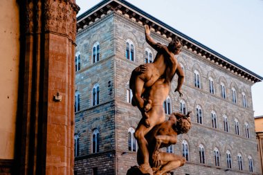 Statue of Ratto delle Sabine, Loggia de Lanzi, Piazza della Sig in Florence, Italy  clipart