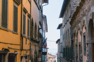 urban scene with beautiful buildings and narrow street, Tuscany, Italy clipart