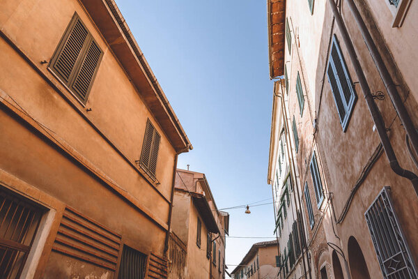 Buildings on street in old city, Pisa, Italy