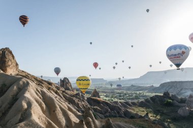 CAPPADOCIA, TURKEY - 09 MAY, 2018: colorful hot air balloons flying above goreme national park, cappadocia, turkey clipart