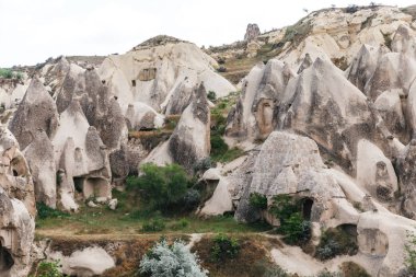 beautiful landscape with famous caves and rock formations in goreme national park, cappadocia, turkey clipart